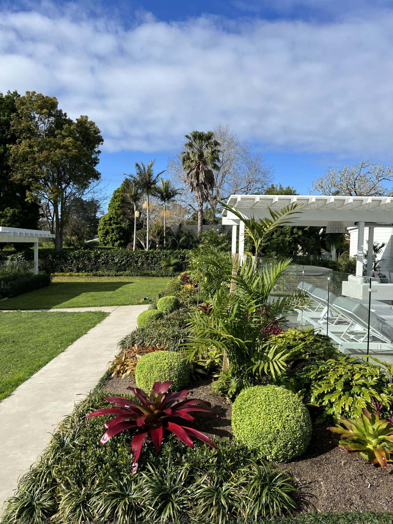 Designer and client reviewing garden plans