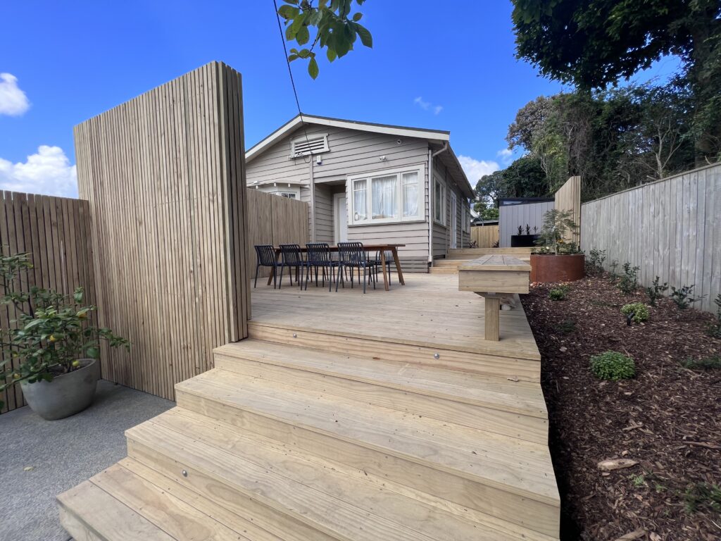 Garden design sketches and material samples laid out on a table